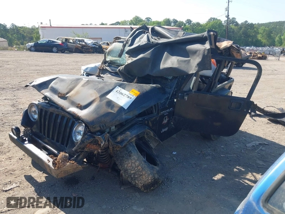 1999 Jeep Wrangler Sahara with VIN 1J4FY49S2XP466068, listed as a IAAI auction lot 42062789 with Not provided miles and . Bid and sale history available at DreamBid. Image 2.