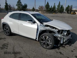 2022 Lexus UX 250h with VIN JTHX9JBH2N2056285, listed as a Copart auction lot 87221214 with 33,377 mi miles and Salvage title. Bid and sale history available at DreamBid. Image 4.