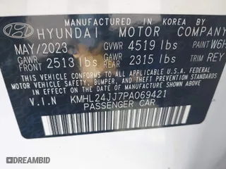 2023 Hyundai Sonata Hybrid Blue with VIN KMHL24JJ7PA069421, listed as a IAAI auction lot 41588205 with 9,650 mi miles. Bid and sale history available at carsss.com. Image 9.