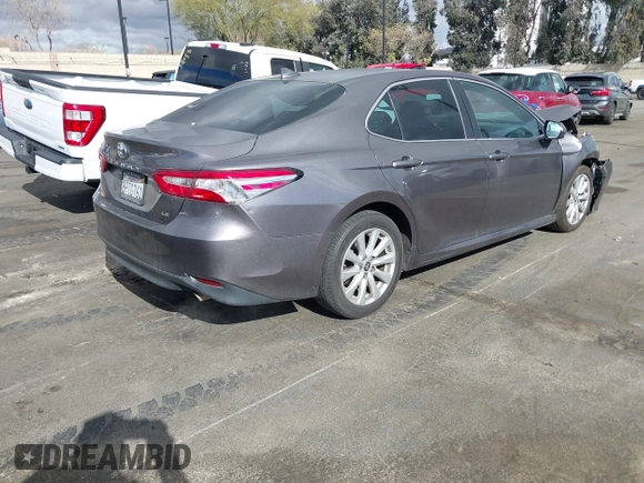 2020 Toyota Camry LE with VIN 4T1C11AK3LU363417, listed as a IAAI auction lot 41430382 with 130,837 mi miles. Bid and sale history available at carsss.com. Image 4.