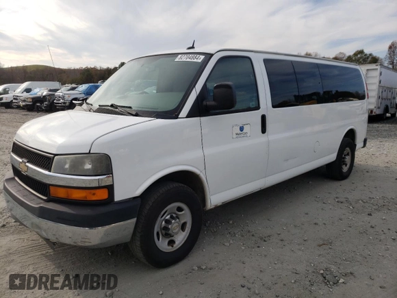 2014 Chevrolet Express Passenger LT with VIN 1GAZG1FG2E1202457, listed as a Copart auction lot 82704884 with 142,982 mi miles and Salvage title. Bid and sale history available at DreamBid. Image 1.