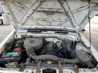 1995 Nissan Frontier with VIN 1N6SD11S3SC379478, listed as a Copart auction lot 52209415 with 21,068 mi miles and Salvage title. Bid and sale history available at DreamBid. Image 11.