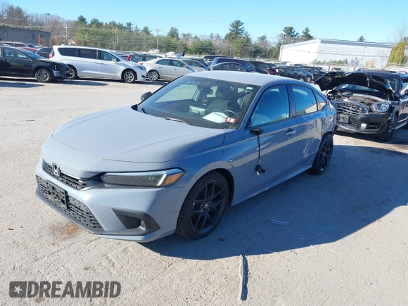 2022 Honda Civic Sport z VIN 2HGFE2F50NH601567, wystawiony jako IAAI lot #40880687 z przebiegiem 16 587 mil mil oraz . Historia ofert i sprzedaży dostępna na DreamBid. Obrazek 2.