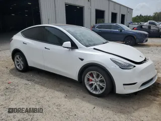 2021 Tesla Model Y Long Range with VIN 5YJYGDEE5MF203130, listed as a Copart auction lot 54642795 with 73,663 mi miles and Non Repairable. Bid and sale history available at DreamBid. Image 4.