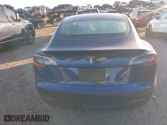 2022 Tesla Model 3 with VIN 5YJ3E1EA3NF190553, listed as a IAAI auction lot 41760731 with 90,268 mi miles. Bid and sale history available at carsss.com. Image 16.