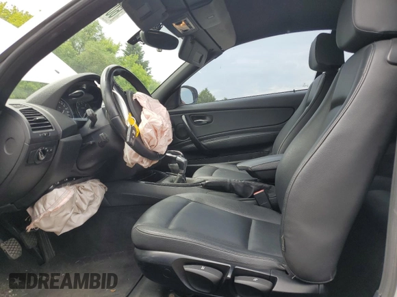 2012 BMW 1 Series 128i with VIN WBAUL7C52CVE87413, listed as a Copart auction lot 60557095 with 148,311 mi miles and Clean title. Bid and sale history available at DreamBid. Image 7.