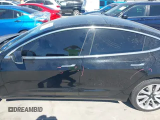 2020 Tesla Model 3 Standard Range Plus with VIN 5YJ3E1EAXLF614002, listed as a IAAI auction lot 41758898 with 42,363 mi miles and . Bid and sale history available at DreamBid. Image 14.