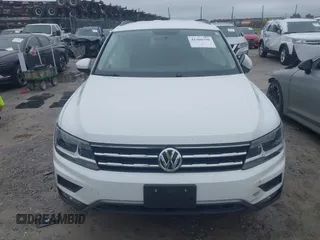 2018 Volkswagen Tiguan S with VIN 3VV1B7AX1JM032250, listed as a IAAI auction lot 42366790 with 65,406 mi miles and . Bid and sale history available at DreamBid. Image 12.