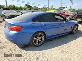 2015 BMW 4 Series 428i xDrive with VIN WBA4C9C5XFG135004, listed as a Copart auction lot 60551714 with 209,083 mi miles and Salvage Title. Bid and sale history available at DreamBid. Image 3.
