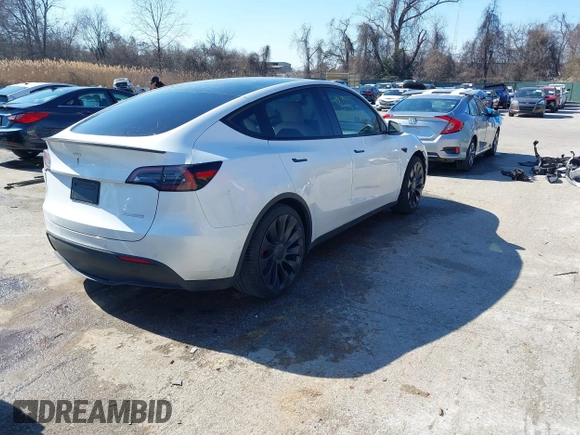 2021 Tesla Model Y Performance with VIN 5YJYGDEF8MF246658, listed as a IAAI auction lot 41679793 with 28,015 mi miles and . Bid and sale history available at DreamBid. Image 4.