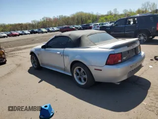1999 Ford Mustang with VIN 1FAFP4448XF233101, listed as a Copart auction lot 54701005 with 54,585 mi miles and Salvage title. Bid and sale history available at DreamBid. Image 2.