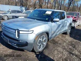 2022 Rivian R1T Adventure Package with VIN 7FCTGAAA1NN012328, listed as a IAAI auction lot 41307929 with 13,588 mi miles. Bid and sale history available at carsss.com. Image 20.
