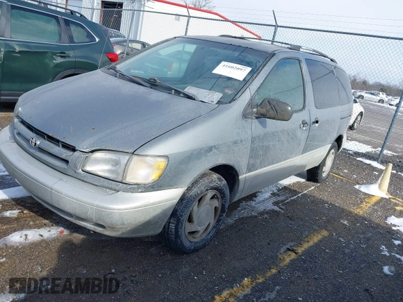 1999 Toyota Sienna LE with VIN 4T3ZF13C2XU118641, listed as a IAAI auction lot 41602097 with 261,792 mi miles. Bid and sale history available at carsss.com. Image 2.