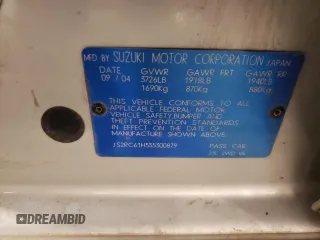 2005 Suzuki Aerio SX z VIN JS2RC61H555300879, wystawiony jako Copart lot #80481084 z przebiegiem 129 196 mil mil oraz Szkody całkowita. Historia ofert i sprzedaży dostępna na DreamBid. Obrazek 14.