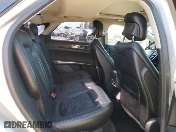 2015 Lincoln MKZ z VIN 3LN6L2G9XFR610736, wystawiony jako Copart lot #80662274 z przebiegiem 101 441 mil mil oraz Szkoda całkowita • Salvage title. Historia ofert i sprzedaży dostępna na DreamBid. Obrazek 10.
