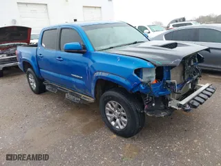 2016 Toyota Tacoma SR with VIN 5TFCZ5AN4GX013233, listed as a IAAI auction lot 41394610 with 142,099 mi miles. Bid and sale history available at carsss.com. Image 1.