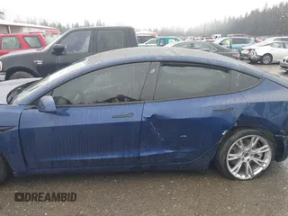 2022 Tesla Model 3 Long Range with VIN 5YJ3E1EB1NF142574, listed as a IAAI auction lot 41213900 with 127,404 mi miles and . Bid and sale history available at DreamBid. Image 14.