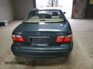 2000 Mazda Millenia z VIN JM1TA2212Y1610919, wystawiony jako Copart lot #80375014 z przebiegiem 127 938 mil mil oraz Szkody całkowita. Historia ofert i sprzedaży dostępna na DreamBid. Obrazek 6.