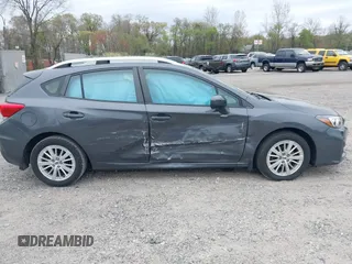 2018 Subaru Impreza Premium z VIN 4S3GTAD61J3703780, wystawiony jako IAAI lot #42081604 z przebiegiem 79 757 mil mil oraz . Historia ofert i sprzedaży dostępna na DreamBid. Obrazek 13.