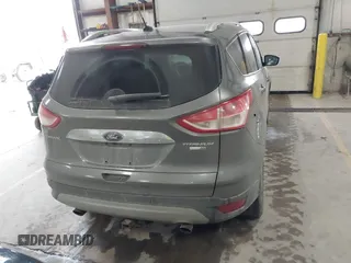 2014 Ford Escape Titanium with VIN 1FMCU9J90EUC31625, listed as a IAAI auction lot 41492075 with 301,917 mi miles and . Bid and sale history available at DreamBid. Image 16.