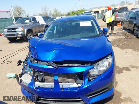 2018 Honda Civic LX with VIN 19XFC2F53JE020297, listed as a IAAI auction lot 42114807 with 124,058 mi miles and . Bid and sale history available at carsss.com. Image 12.