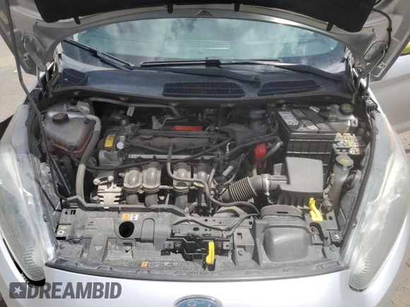 2014 Ford Fiesta SE z VIN 3FADP4BJ8EM133030, wystawiony jako Copart lot #52046065 z przebiegiem 113 792 mil mil oraz Szkoda całkowita • Salvage title. Historia ofert i sprzedaży dostępna na DreamBid. Obrazek 11.