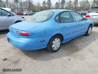 1999 Ford Taurus SE with VIN 1FAFP53U2XA154351, listed as a IAAI auction lot 41943794 with 125,085 mi miles. Bid and sale history available at carsss.com. Image 4.