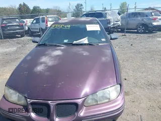 1998 Pontiac Grand Am SE with VIN 1G2NE52M1WC783104, listed as a IAAI auction lot 41911849 with 234,503 mi miles. Bid and sale history available at carsss.com. Image 6.