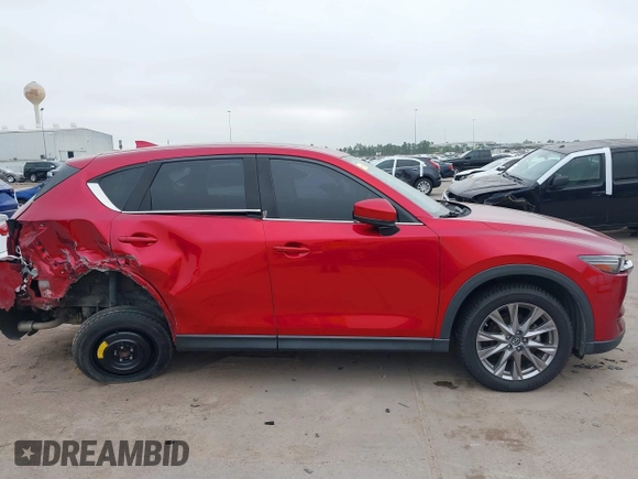 2020 Mazda CX-5 Grand Touring with VIN JM3KFADM7L0729537, listed as a IAAI auction lot 41864569 with 82,998 mi miles. Bid and sale history available at carsss.com. Image 14.