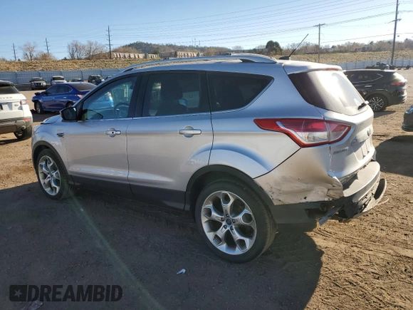 2014 Ford Escape Titanium with VIN 1FMCU9J9XEUB10861, listed as a Copart auction lot 50766115 with 134,469 mi miles and Salvage Title. Bid and sale history available at DreamBid. Image 2.
