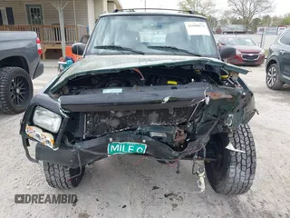 1999 Jeep Cherokee Sport with VIN 1J4FF68S1XL555463, listed as a IAAI auction lot 41898076 with 206,656 mi miles. Bid and sale history available at carsss.com. Image 6.