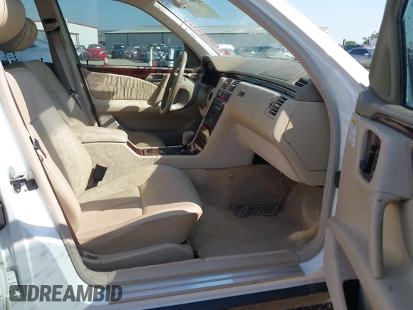 1999 Mercedes-Benz E-Class with VIN WDBJF65H6XA867166, listed as a IAAI auction lot 42017341 with 89,841 mi miles. Bid and sale history available at carsss.com. Image 5.