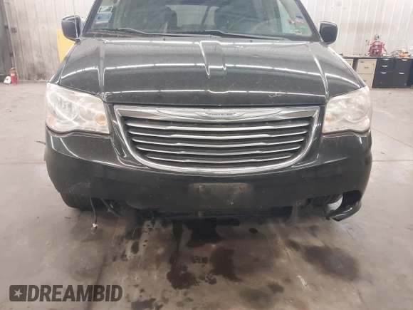 2013 Chrysler Town & Country Touring z VIN 2C4RC1BG0DR742005, wystawiony jako IAAI lot #42386516 z przebiegiem 200 982 mil mil oraz . Historia ofert i sprzedaży dostępna na DreamBid. Obrazek 6.
