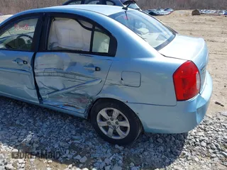 2007 Hyundai Accent GLS with VIN KMHCN46C57U159120, listed as a IAAI auction lot 42021811 with 114,564 mi miles. Bid and sale history available at carsss.com. Image 6.