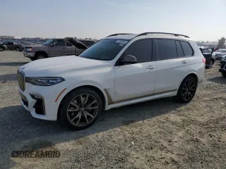 2020 BMW X7 M50i z VIN 5UXCX6C07LLE35920, wystawiony jako Copart lot #83606344 z przebiegiem 99 780 mil mil oraz Czysty tytuł • Clean title. Historia ofert i sprzedaży dostępna na DreamBid. Obrazek 1.