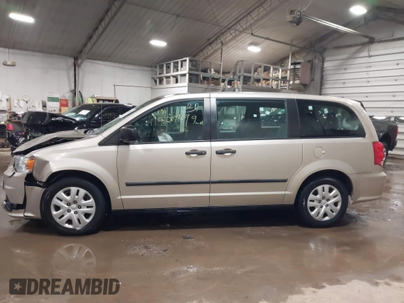 2015 Dodge Grand Caravan SE with VIN 2C4RDGBG2FR592899, listed as a IAAI auction lot 41309499 with 110,428 mi miles and . Bid and sale history available at DreamBid. Image 14.