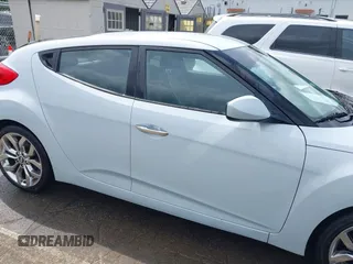 2015 Hyundai Veloster z VIN KMHTC6AD8FU222744, wystawiony jako IAAI lot #42129397 z przebiegiem Nie podano mil oraz . Historia ofert i sprzedaży dostępna na DreamBid. Obrazek 12.