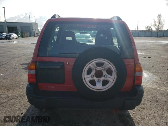 2003 Chevrolet Tracker with VIN 2CNBE13CX36943395, listed as a Copart auction lot 70964574 with 118,975 mi miles and Salvage title. Bid and sale history available at DreamBid. Image 6.