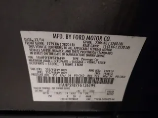 2015 Ford Taurus Limited with VIN 1FAHP2F87FG136199, listed as a IAAI auction lot 41920715 with 173,445 mi miles. Bid and sale history available at carsss.com. Image 9.