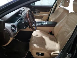 2016 Jaguar XJ with VIN SAJXJ1GD2G8V98776, listed as a Copart auction lot 41959995 with 77,391 mi miles and Salvage title. Bid and sale history available at DreamBid. Image 7.