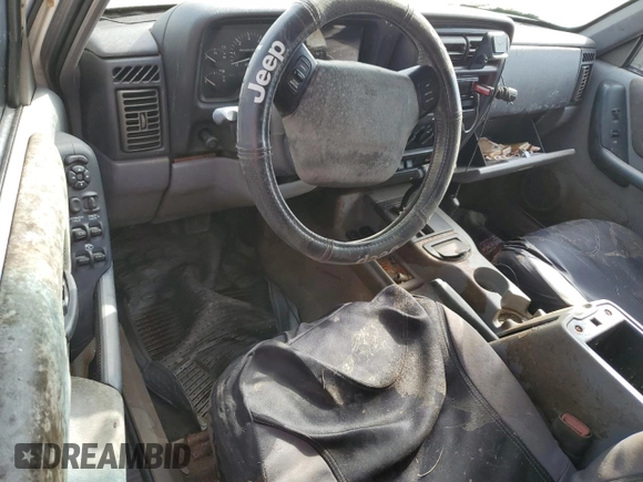 1998 Jeep Cherokee Sport with VIN 1J4FT68S8WL101900, listed as a Copart auction lot 86476444 with 0 mi miles and Salvage Title. Bid and sale history available at carsss.com. Image 8.