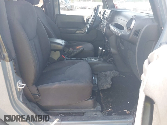 2015 Jeep Wrangler Freedom Edition with VIN 1C4AJWAG1FL714002, listed as a IAAI auction lot 42579024 with 98,732 mi miles and . Bid and sale history available at DreamBid. Image 5.