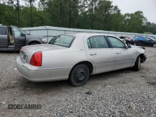 2003 Lincoln Town Car Executive z VIN 1LNHM81W93Y630917, wystawiony jako Copart lot #58377215 z przebiegiem 202 486 mil mil oraz Szkoda całkowita • Salvage title. Historia ofert i sprzedaży dostępna na DreamBid. Obrazek 3.