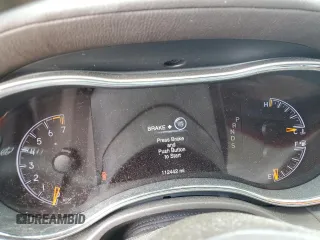 2015 Jeep Grand Cherokee Overland with VIN 1C4RJFCG3FC880084, listed as a Copart auction lot 57291165 with 112,442 mi miles and Salvage title. Bid and sale history available at DreamBid. Image 9.