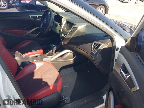 2012 Hyundai Veloster w/Black Int z VIN KMHTC6AD4CU078413, wystawiony jako IAAI lot #42611032 z przebiegiem 142 295 mil mil oraz . Historia ofert i sprzedaży dostępna na DreamBid. Obrazek 5.