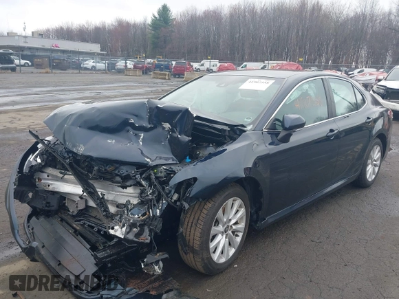 2020 Toyota Camry LE with VIN 4T1L11AK3LU977805, listed as a IAAI auction lot 41907558 with 82,237 mi miles and . Bid and sale history available at DreamBid. Image 18.