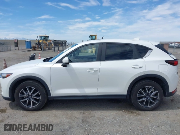 2018 Mazda CX-5 Touring with VIN JM3KFACM3J0381122, listed as a IAAI auction lot 42023838 with 76,121 mi miles. Bid and sale history available at carsss.com. Image 14.