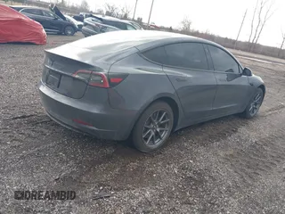 2023 Tesla Model 3 with VIN 5YJ3E1EAXPF693693, listed as a IAAI auction lot 41709704 with 12,473 mi miles and . Bid and sale history available at DreamBid. Image 4.