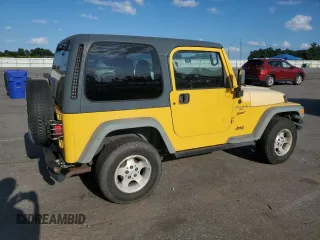 2000 Jeep Wrangler Sport with VIN 1J4FA49SXYP745676, listed as a Copart auction lot 63096755 with 147,226 mi miles and Salvage title. Bid and sale history available at DreamBid. Image 3.