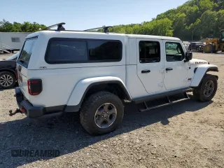 2023 Jeep Gladiator Rubicon with VIN 1C6JJTBG9PL546437, listed as a Copart auction lot 62536575 with 14,106 mi miles and Salvage title. Bid and sale history available at DreamBid. Image 3.